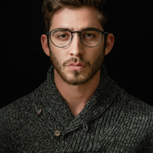 Close-up of stylish black round eyeglasses with subtle gold hardware.