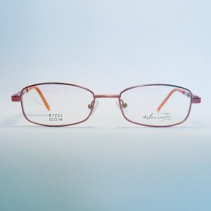 Stylish pink metal rectangular eyeglasses with orange temple tips, ideal for fashion and vision enhancement." . Available at website - www.spexovision.com